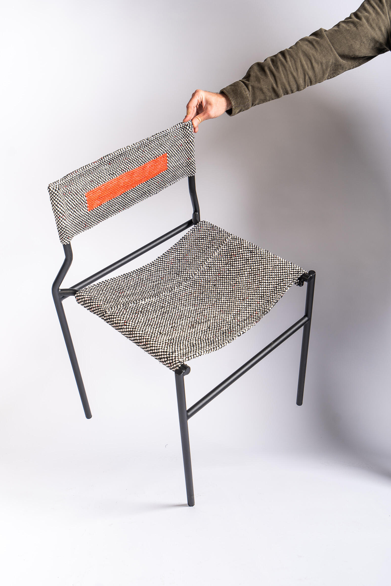 Handcrafted Chair with Recycled Fabric Experimental chair combining Recycled plastic bags woven textile craftsmanship with a contemporary structure