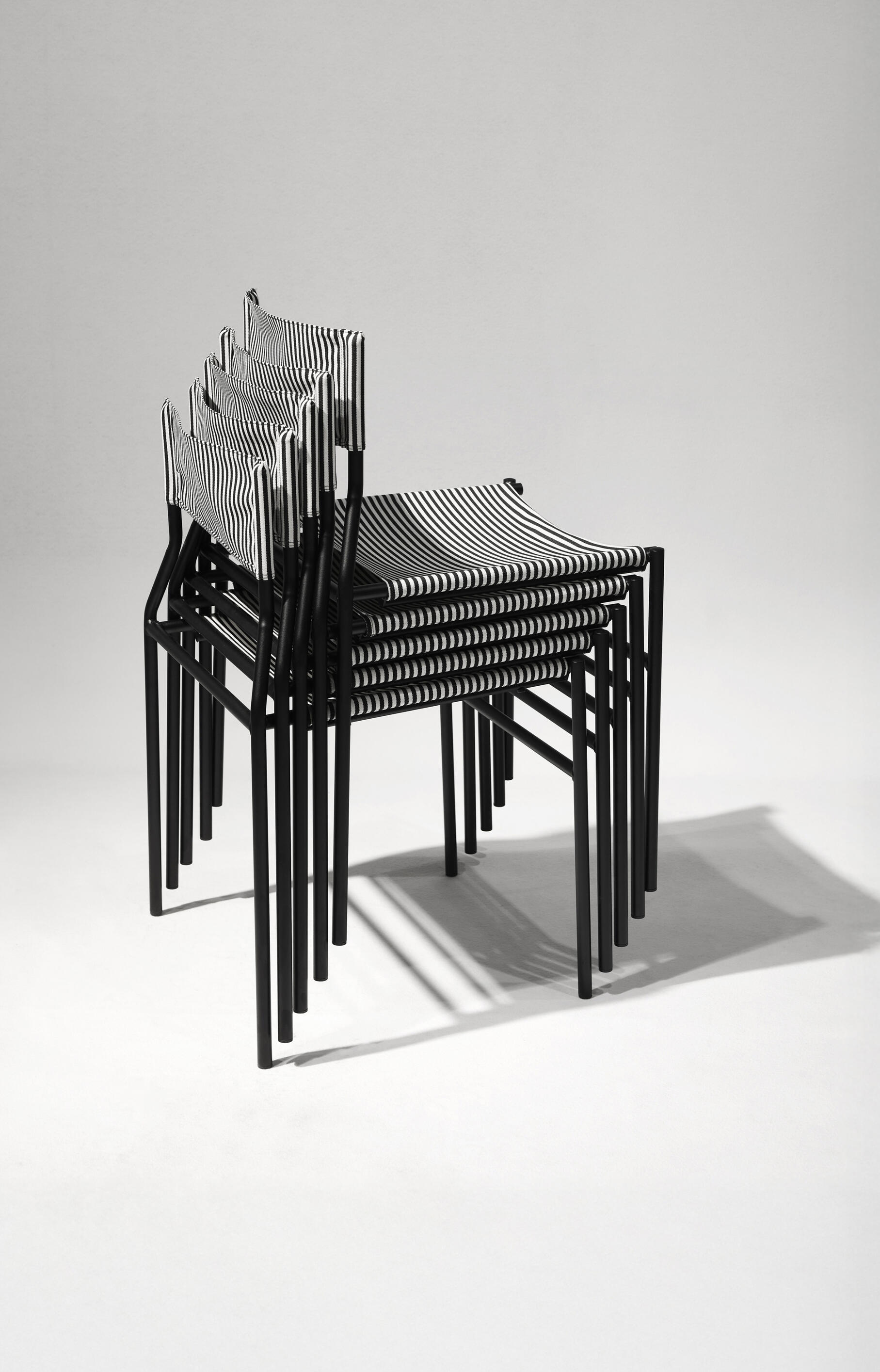 Airborne H chair Collection Stackable contemporary chairs designed for efficient series production, integrating innovative manufacturing, material efficiency, and sustainable product design.